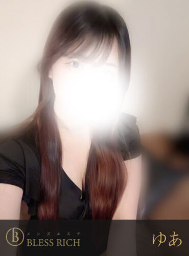 Portrait of a person with long dark hair wearing a black top; face overexposed by a bright flash, Bless Rich watermark at bottom left.